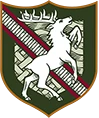A crest featuring a white horse rearing on a diagonal red stripe with a white sword, green shield, and Arabic script at the top.
